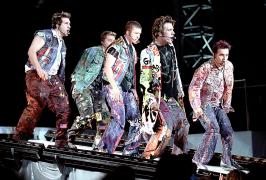2001 - Performing 'Pop' with *NSYNC in camoflauge/newsprint/cut out rags..
